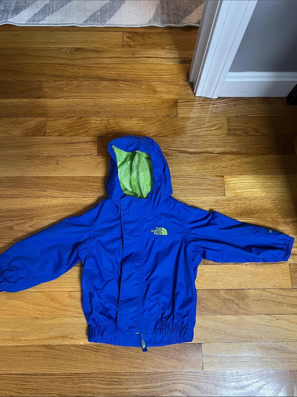 The North Face Kid's Royal Blue Hooded Rain Jacket with Lime Green Lining